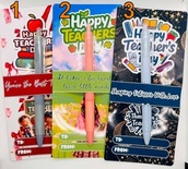 A colorful pen as a gift, in a gift package mentioning Happy Teachers Day